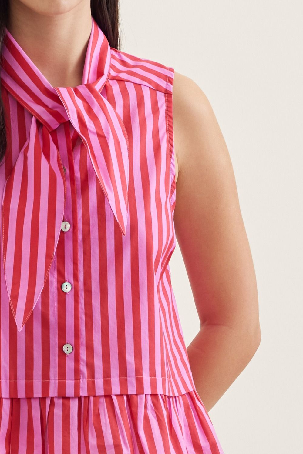Striped Sleeveless Peplum Top w/ Tie Neck